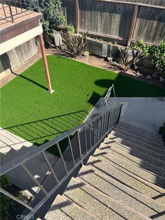 a view of a backyard with sitting area