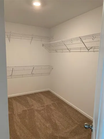 a view of a room with racks on the wall