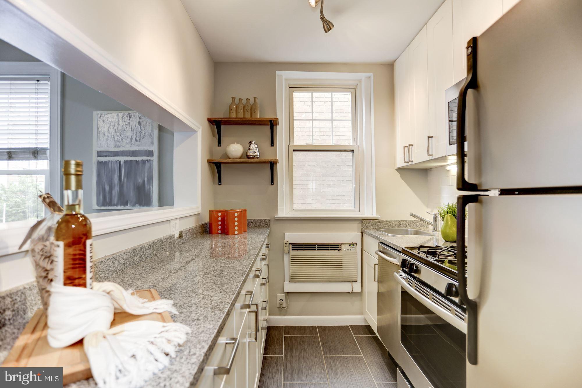1322 15th Street Northwest, Unit 32 Washington, DC 20005 - Photo 8 of 20 renovated kitchen with breakfast bar