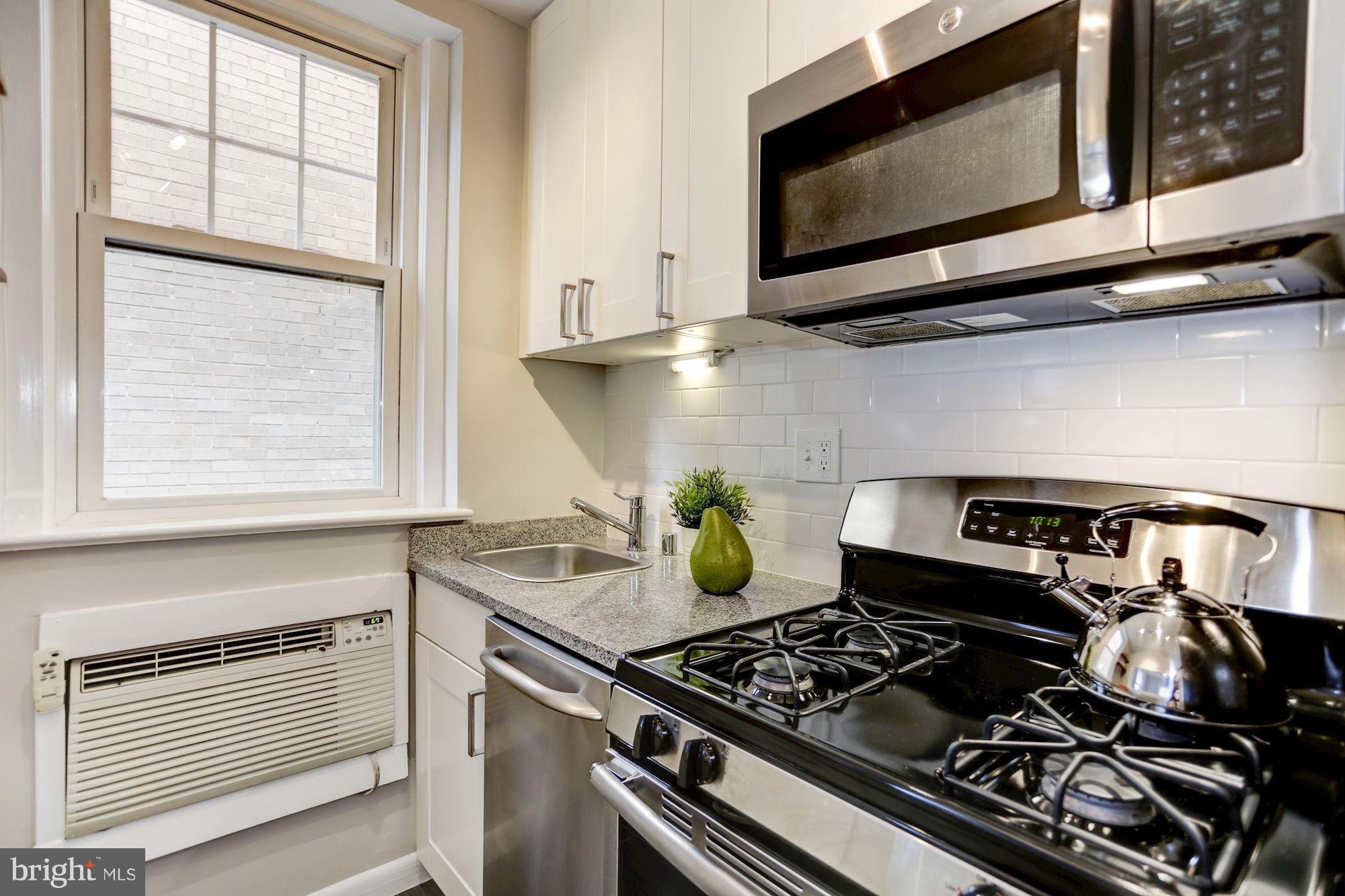 1322 15th Street Northwest, Unit 32 Washington, DC 20005 - Photo 9 of 20 SS appliances and subway tile backsplash