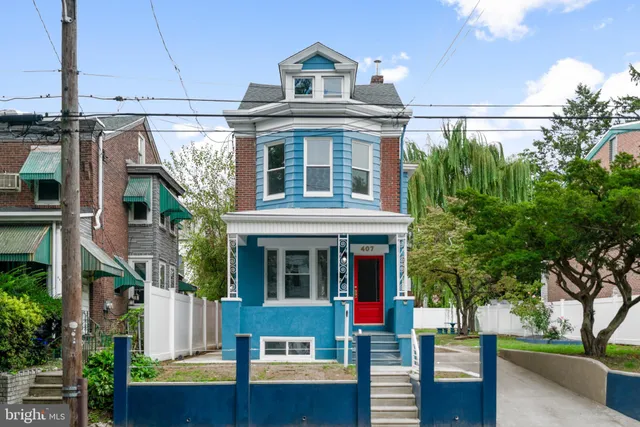 a front view of a building with garden