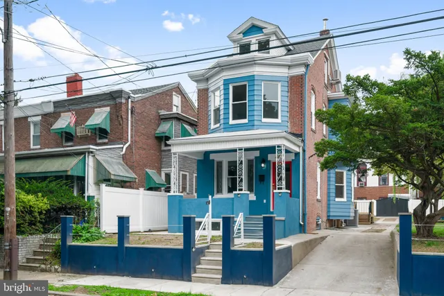 a front view of a building with garden