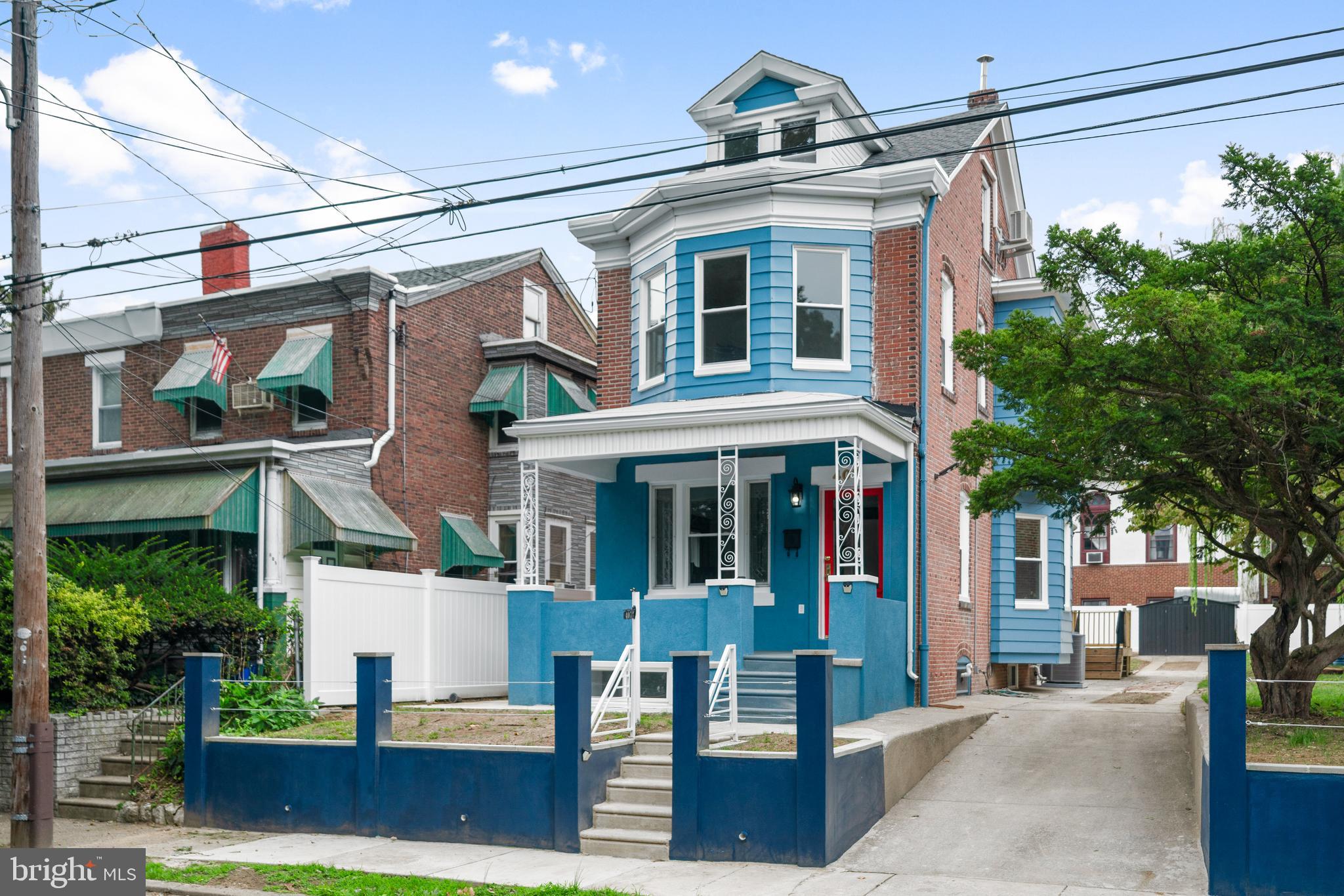 407 Sanger Street Philadelphia, PA 19120 - Photo 11 of 47 a front view of a building with garden