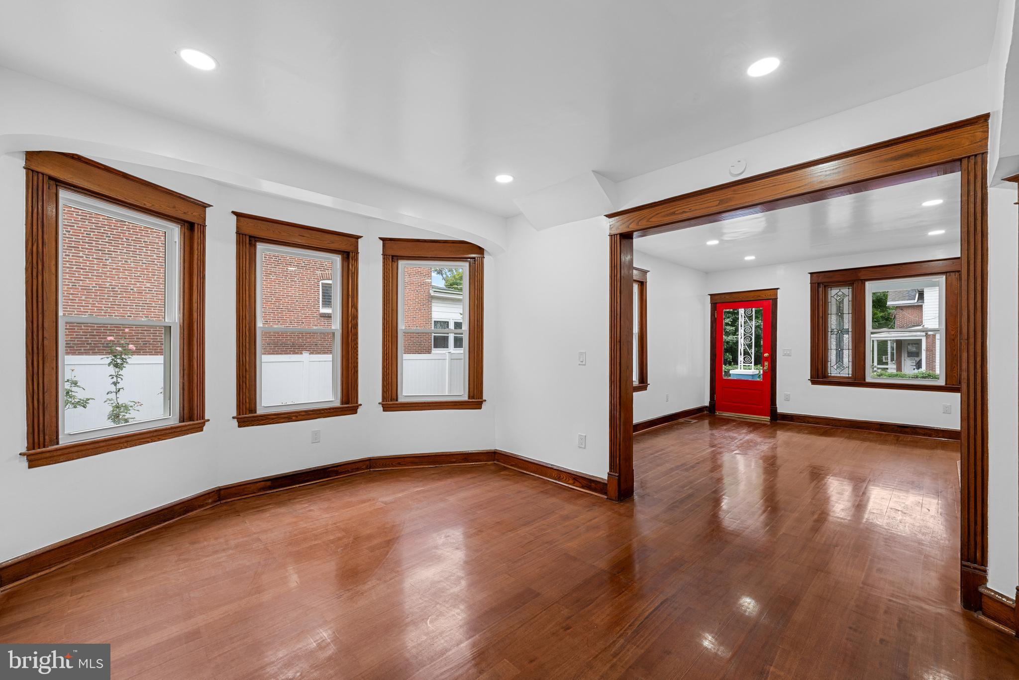 407 Sanger Street Philadelphia, PA 19120 - Photo 17 of 47 a view of an empty room with window and wooden floor