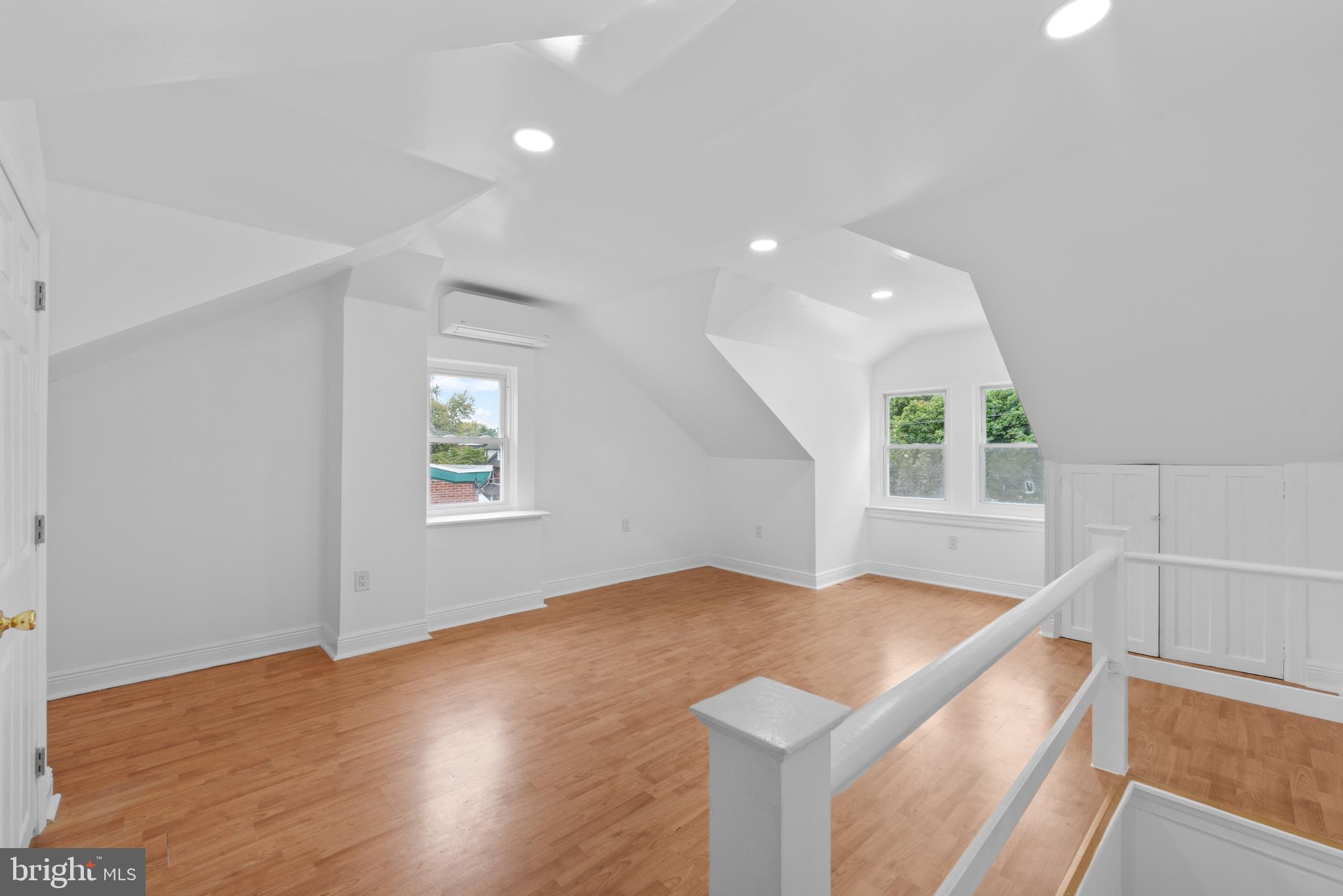 407 Sanger Street Philadelphia, PA 19120 - Photo 23 of 47 a view of an empty room with window and wooden floor