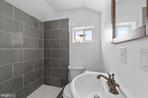a bathroom with a toilet and a sink