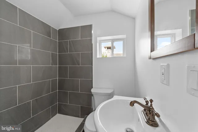 a bathroom with a toilet and a sink