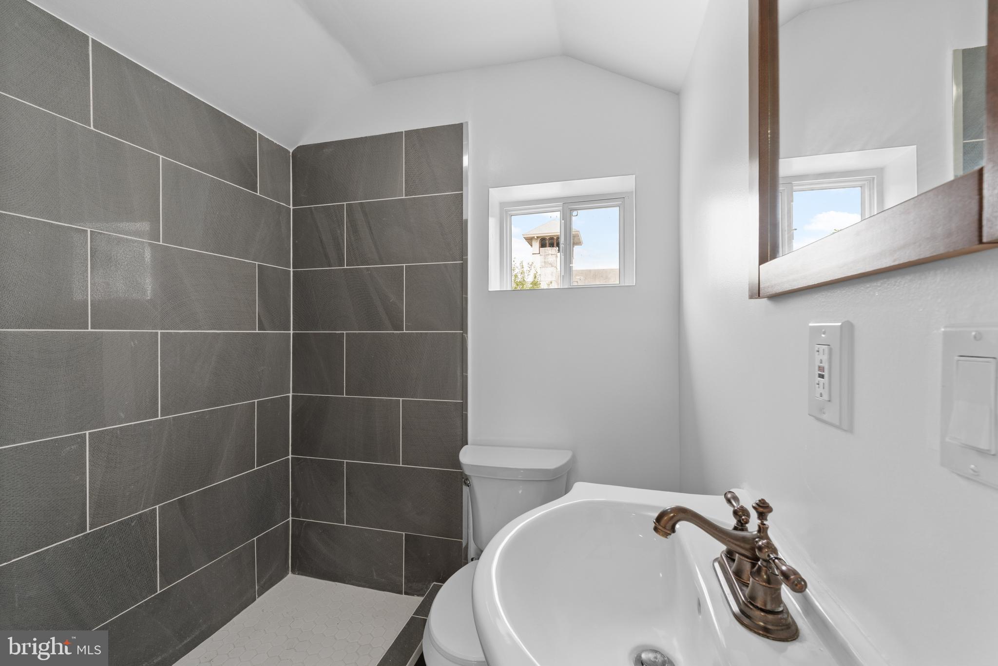 407 Sanger Street Philadelphia, PA 19120 - Photo 25 of 47 a bathroom with a toilet and a sink