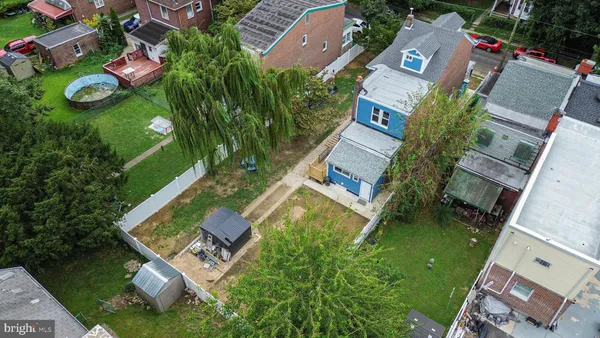 an aerial view of house with yard