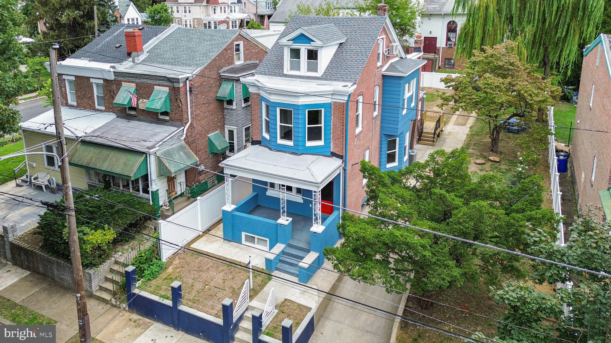 407 Sanger Street Philadelphia, PA 19120 - Photo 10 of 47 an aerial view of a residential apartment building with a yard