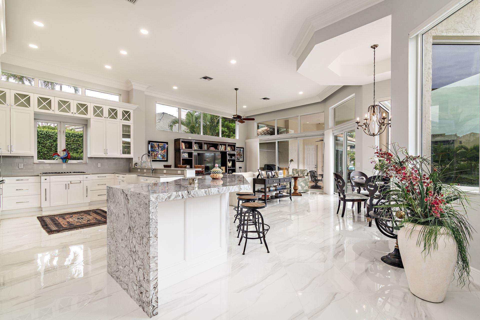 3376 Barrow Island Road Jupiter, FL 33477 - Photo 11 of 48 a living room with furniture and potted plants