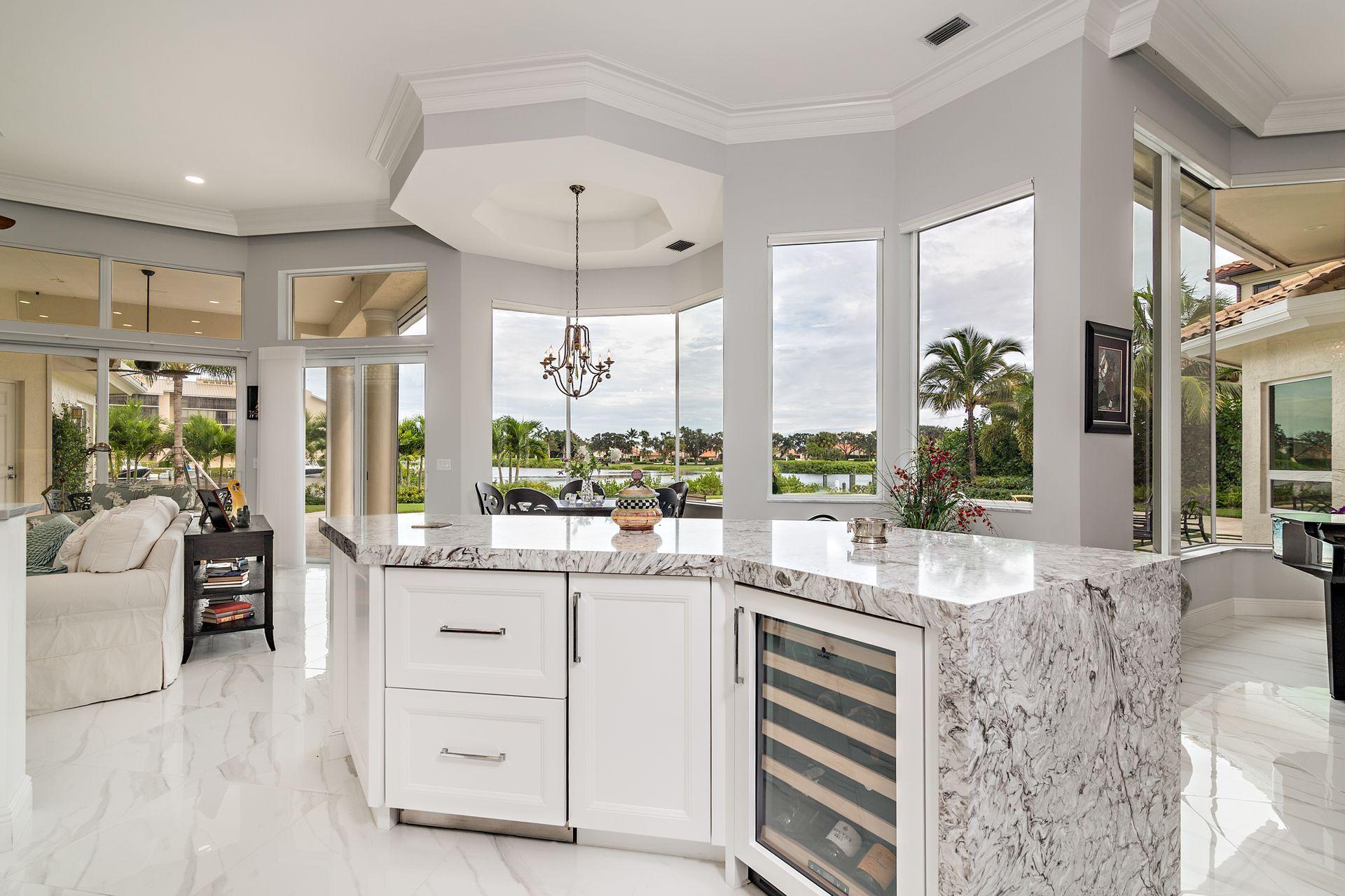 3376 Barrow Island Road Jupiter, FL 33477 - Photo 15 of 48 a room with lot of cabinets and a large window
