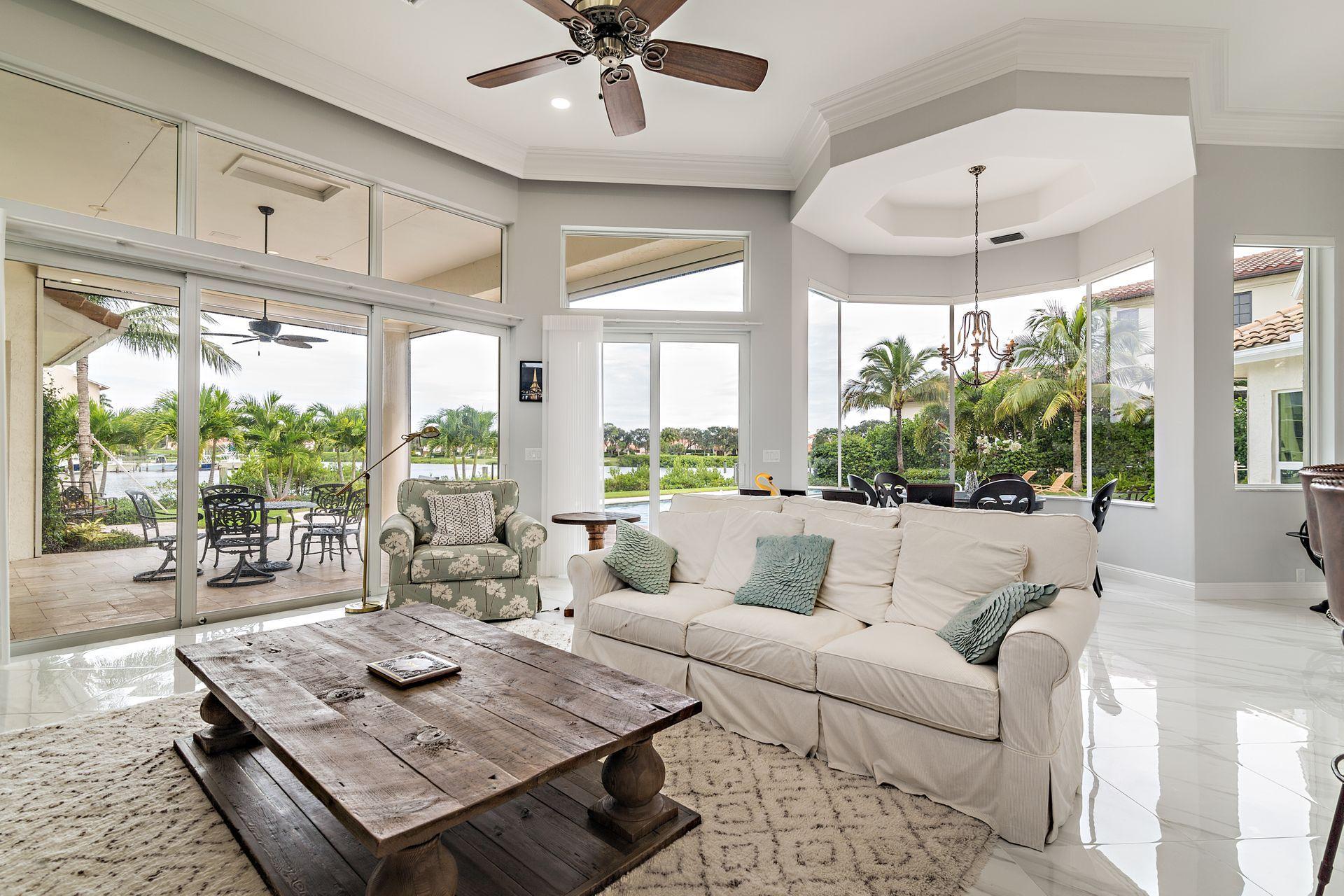 3376 Barrow Island Road Jupiter, FL 33477 - Photo 18 of 48 a living room with furniture and large windows