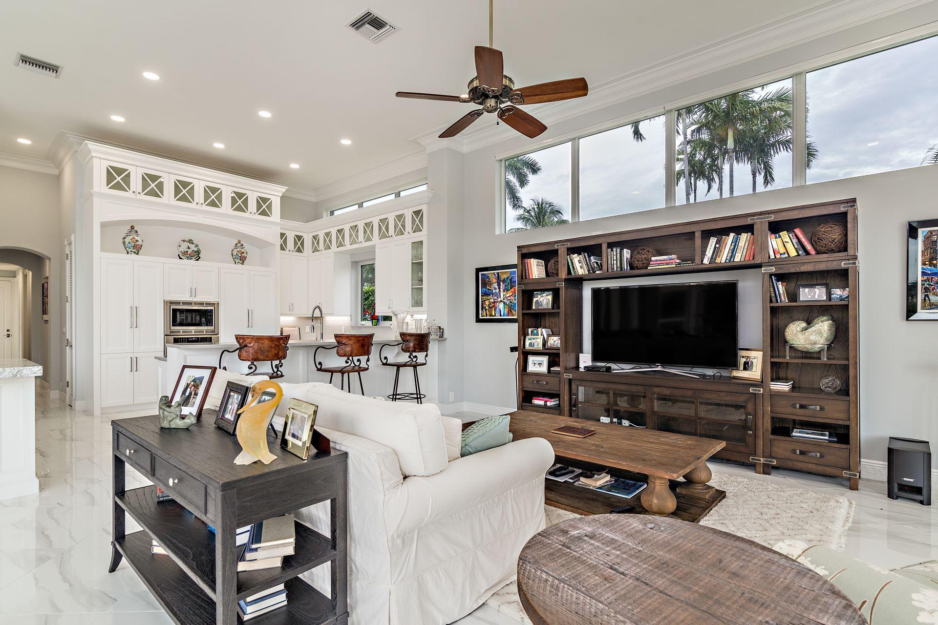 3376 Barrow Island Road Jupiter, FL 33477 - Photo 19 of 48 a living room with furniture and a flat screen tv