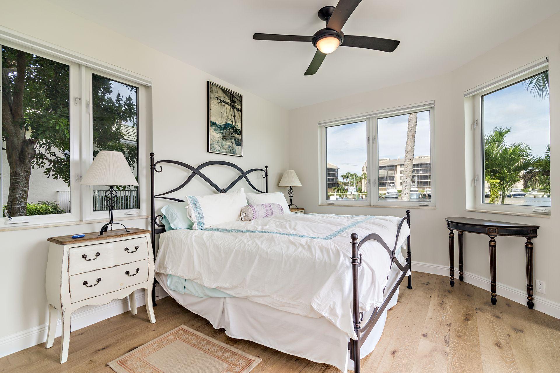 3376 Barrow Island Road Jupiter, FL 33477 - Photo 28 of 48 a bedroom with furniture and windows