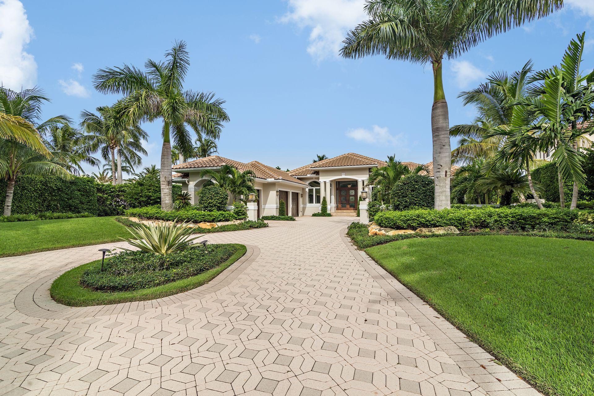 3376 Barrow Island Road Jupiter, FL 33477 - Photo 4 of 48 a front view of a house with garden