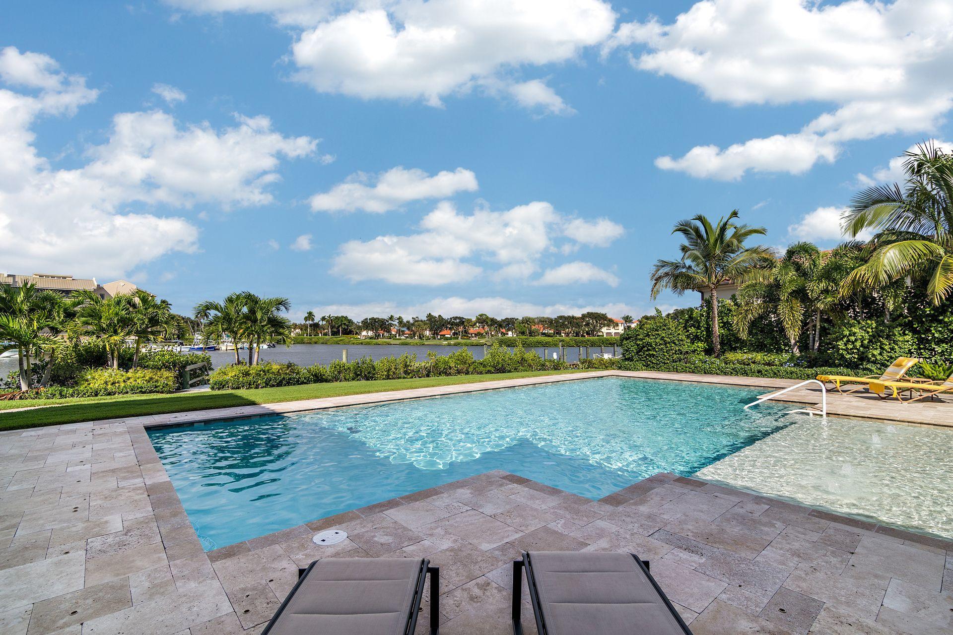 3376 Barrow Island Road Jupiter, FL 33477 - Photo 34 of 48 a view of a lake with a yard