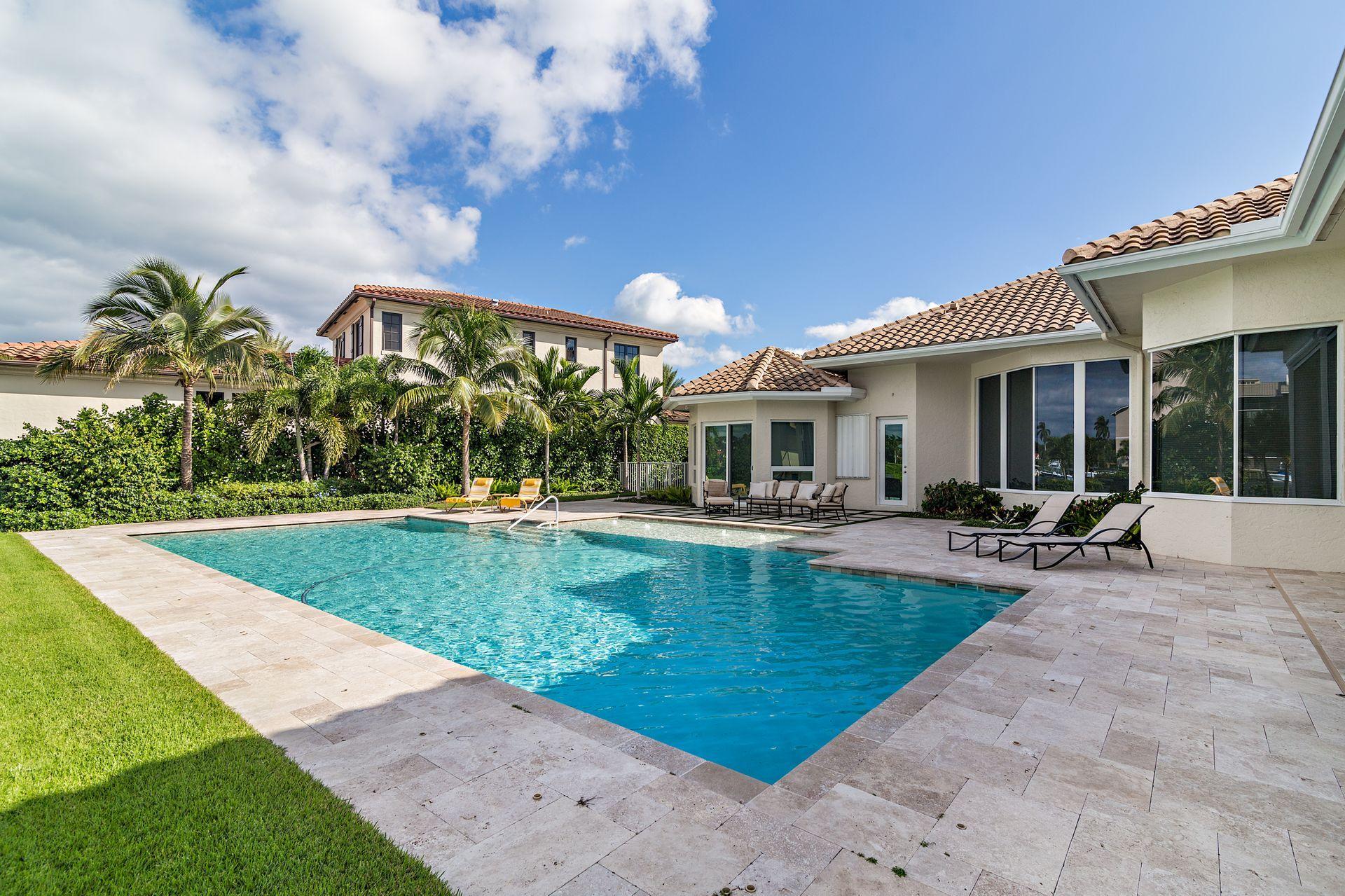 3376 Barrow Island Road Jupiter, FL 33477 - Photo 36 of 48 a view of a house with swimming pool and sitting area