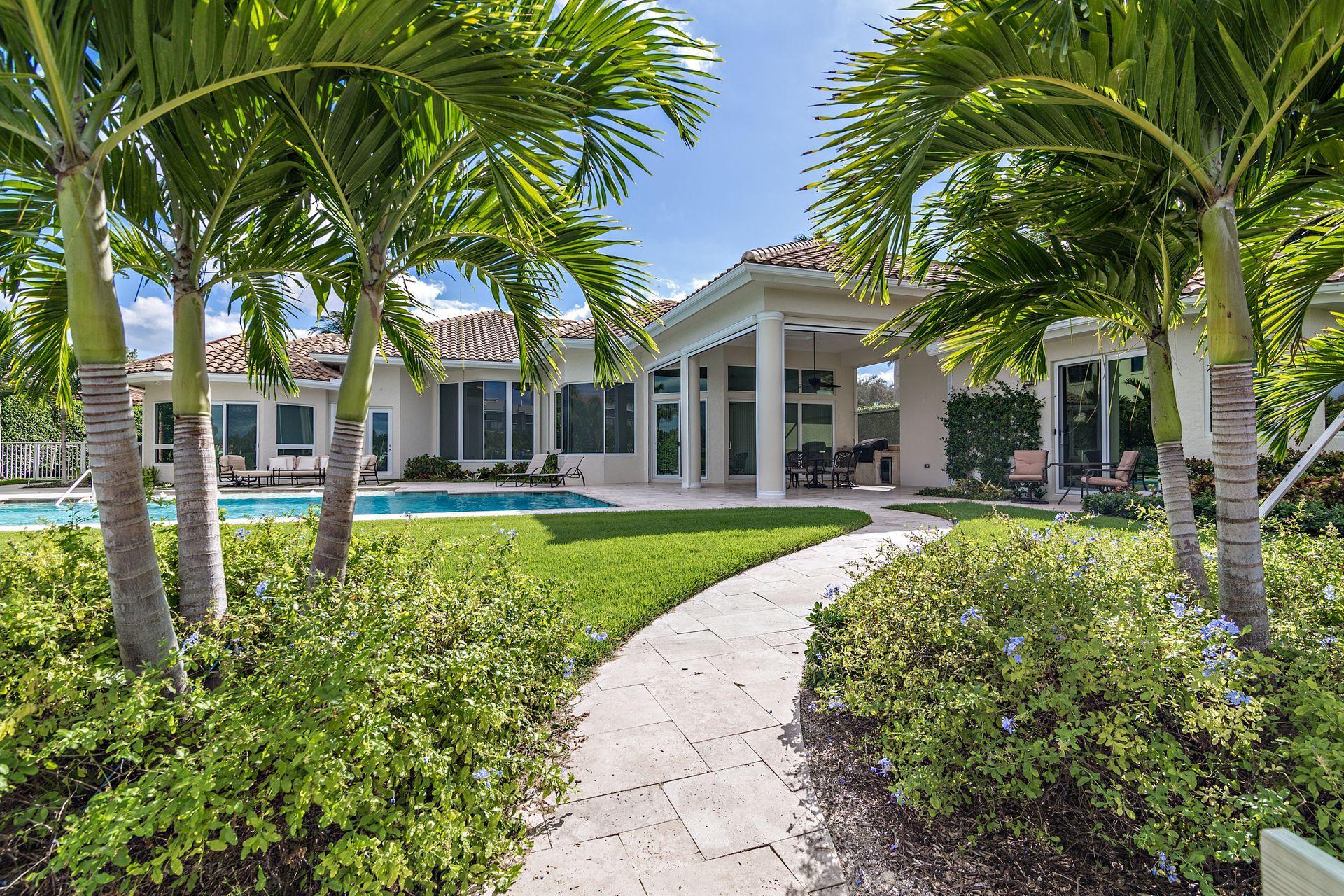 3376 Barrow Island Road Jupiter, FL 33477 - Photo 38 of 48 a view of a house with swimming pool and porch with furniture