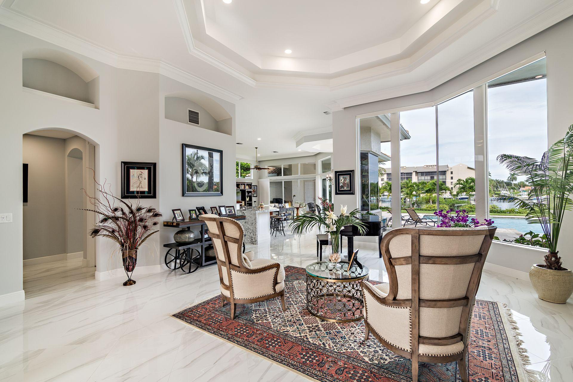 3376 Barrow Island Road Jupiter, FL 33477 - Photo 7 of 48 a living room with furniture a dining table and a potted plant