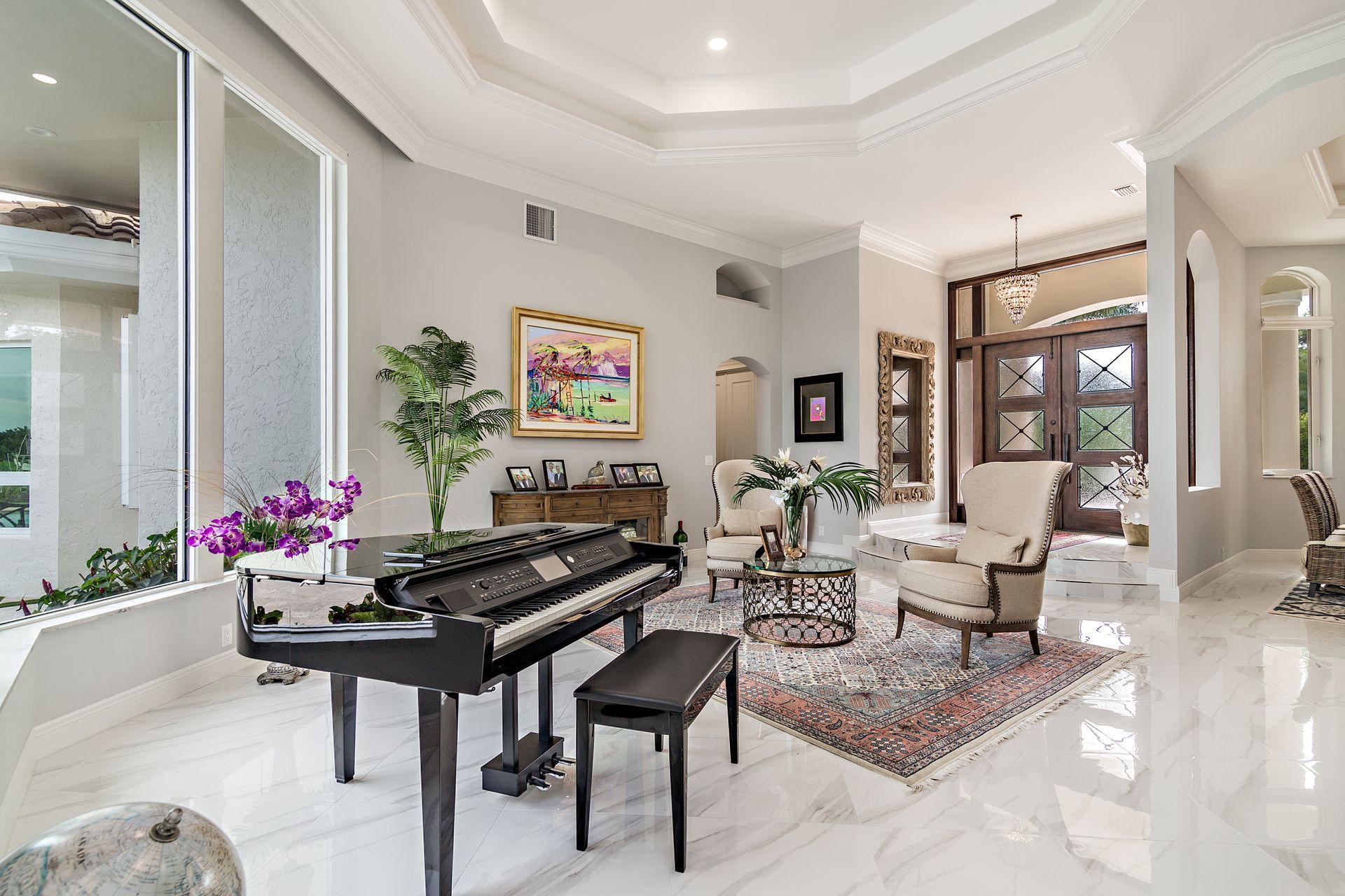 3376 Barrow Island Road Jupiter, FL 33477 - Photo 9 of 48 a living room with furniture and flowers