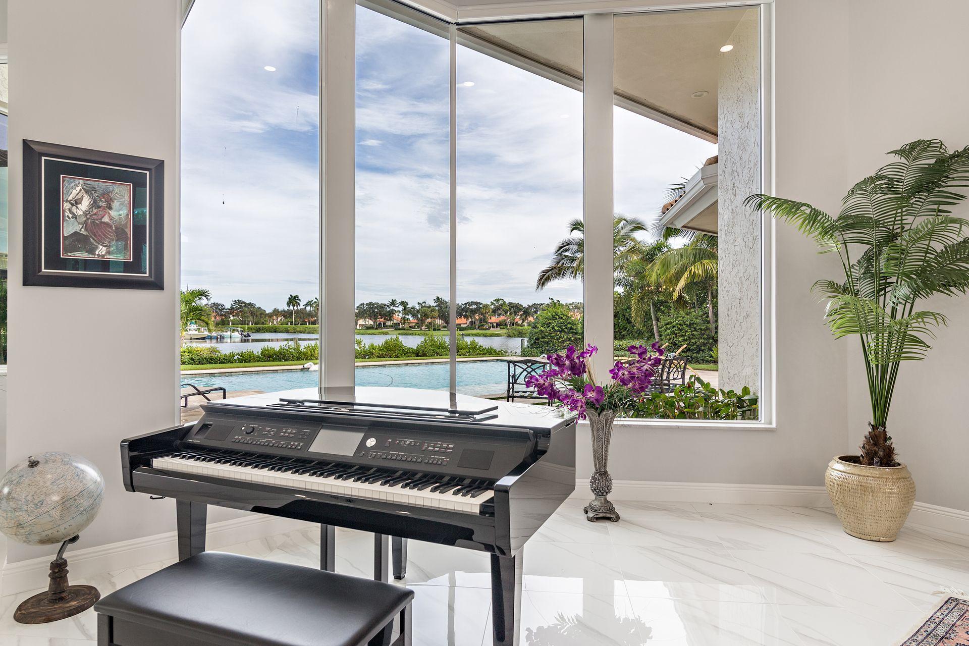 3376 Barrow Island Road Jupiter, FL 33477 - Photo 10 of 48 a room with furniture and a potted plant