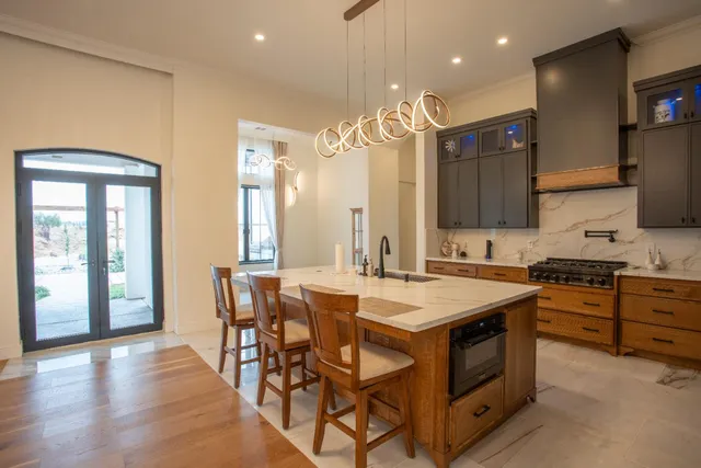a kitchen with lots of clutter and cabinets