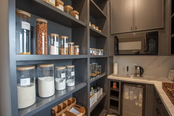 a kitchen with stainless steel appliances granite countertop a refrigerator and a stove