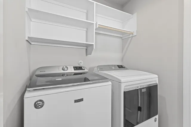 a kitchen with stainless steel appliances granite countertop a sink stove and microwave