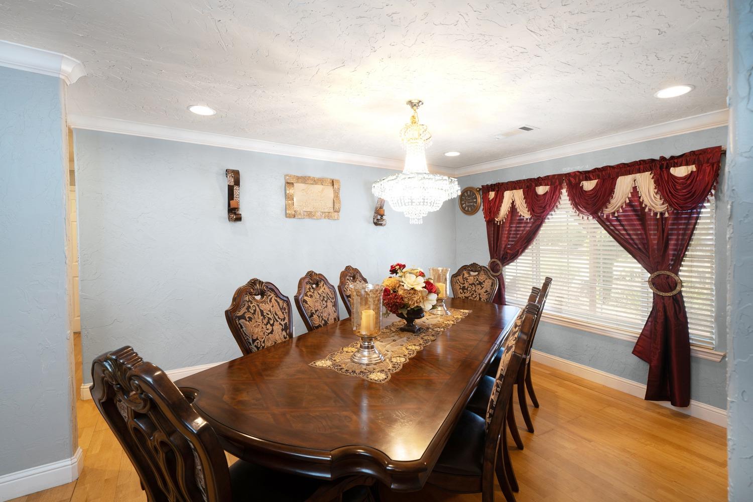 21197 Steward Road Madera, CA 93638 - Photo 19 of 41 a view of a dining room with furniture and wooden floor