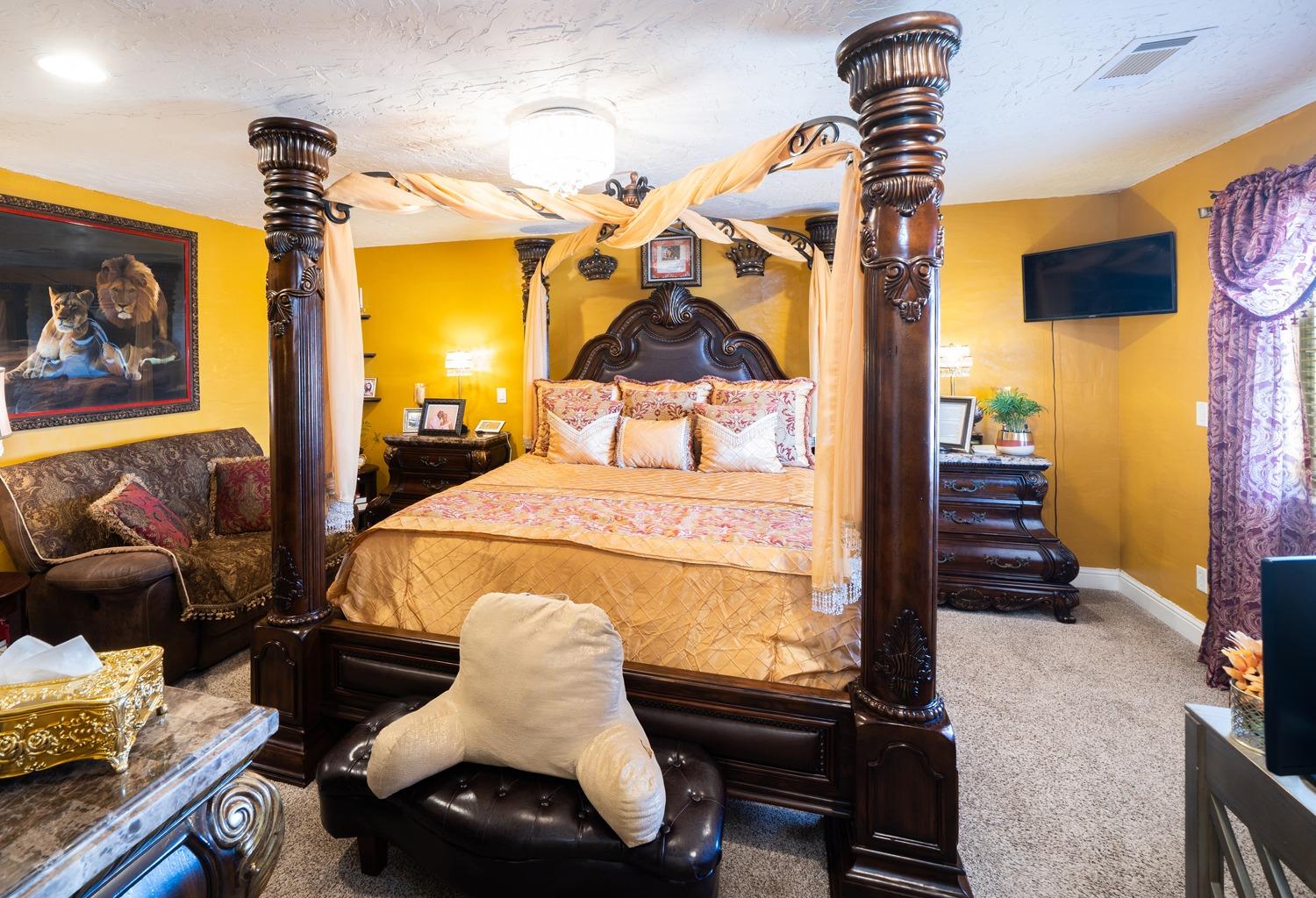 21197 Steward Road Madera, CA 93638 - Photo 22 of 41 a bedroom with a bed and wooden floor