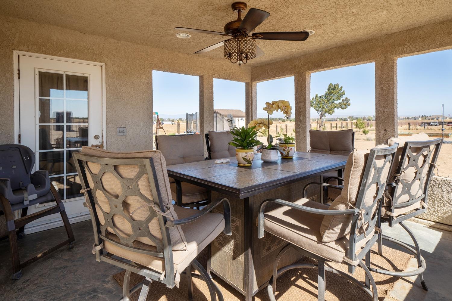 21197 Steward Road Madera, CA 93638 - Photo 32 of 41 a view of a dining room with furniture window and outside view