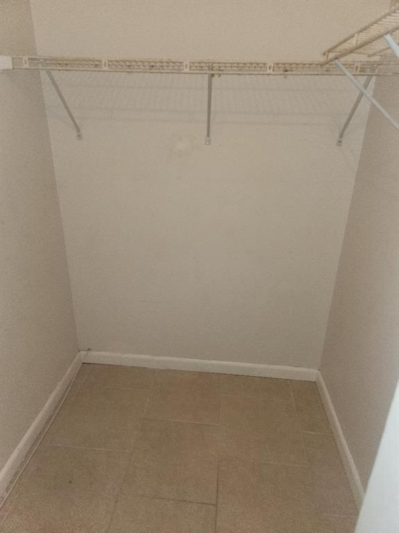 613 South State Road 7, Unit 3E Margate, FL 33068 - Photo 11 of 15 a view of a room with racks on the wall