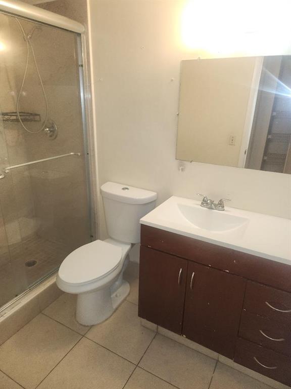 613 South State Road 7, Unit 3E Margate, FL 33068 - Photo 12 of 15 a bathroom with a sink toilet and shower