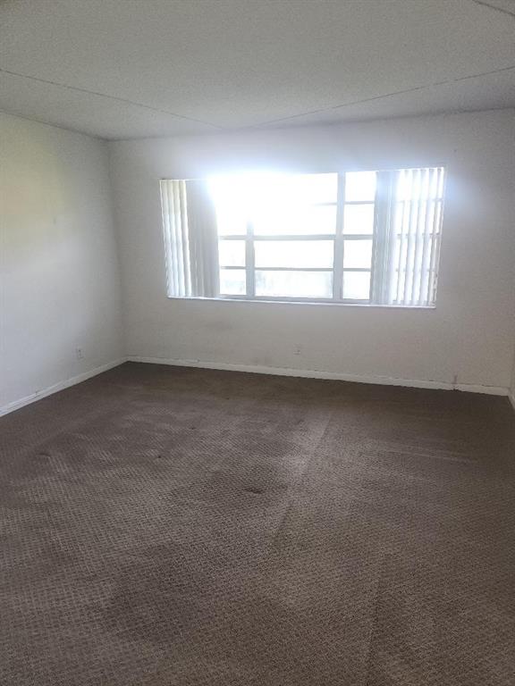 613 South State Road 7, Unit 3E Margate, FL 33068 - Photo 14 of 15 an empty room with a window