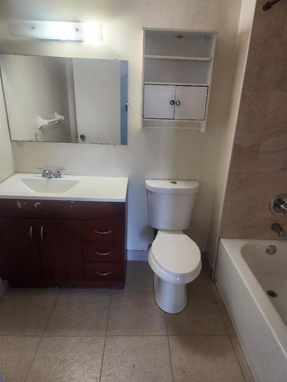 613 South State Road 7, Unit 3E Margate, FL 33068 - Photo 15 of 15 a bathroom with a toilet sink and mirror