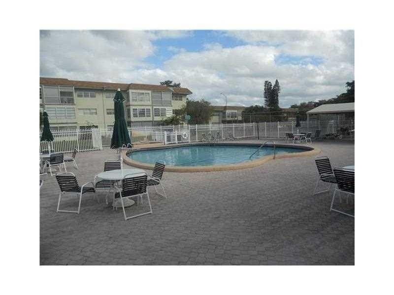 613 South State Road 7, Unit 3E Margate, FL 33068 - Photo 2 of 15 a view of a terrace with chairs