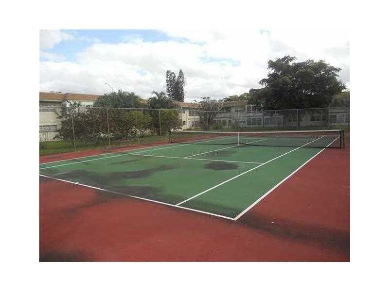 613 South State Road 7, Unit 3E Margate, FL 33068 - Photo 3 of 15 a view of a tennis court