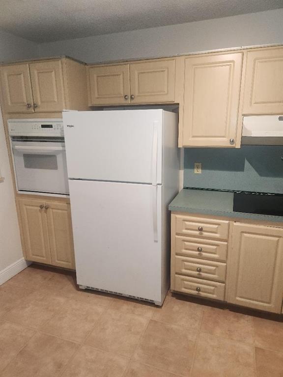 613 South State Road 7, Unit 3E Margate, FL 33068 - Photo 8 of 15 a white refrigerator freezer sitting in a kitchen