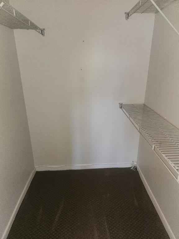 613 South State Road 7, Unit 3E Margate, FL 33068 - Photo 10 of 15 a view of an empty walk in closet
