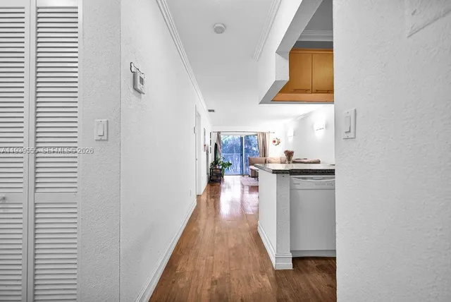 a view of a kitchen from the hallway
