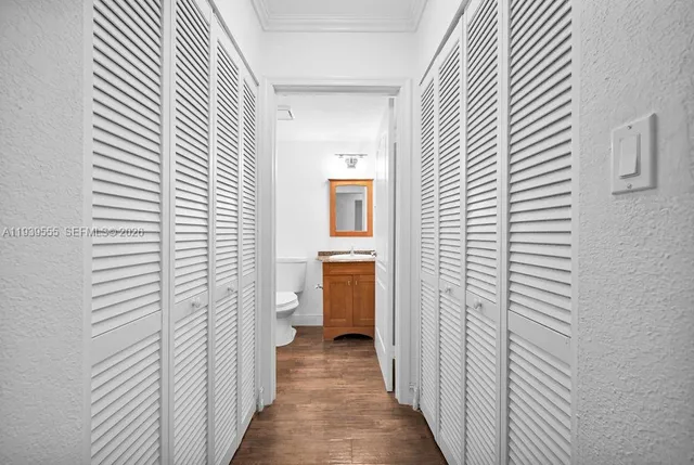 a view of a bathroom from the hallway