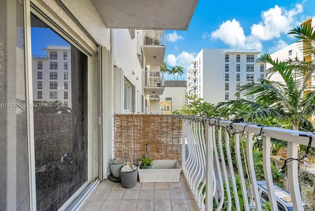 a view of balcony with potted plants