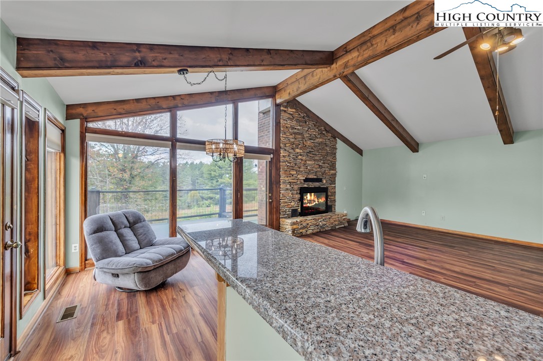 255 Clear View Ridge Crumpler, NC 28617 - Photo 13 of 42 a living room with furniture and a floor to ceiling window