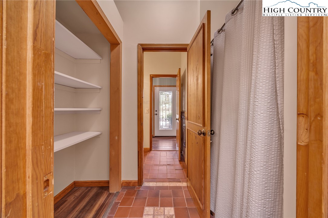 255 Clear View Ridge Crumpler, NC 28617 - Photo 18 of 42 a view of a hallway with wooden floor and a bathroom
