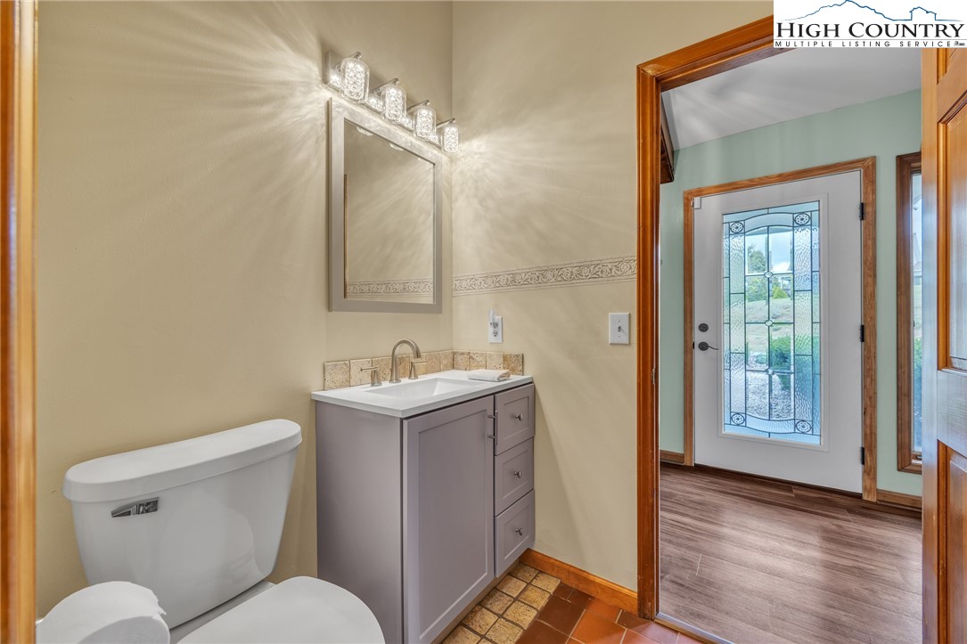 255 Clear View Ridge Crumpler, NC 28617 - Photo 19 of 42 a bathroom with a toilet a sink and mirror