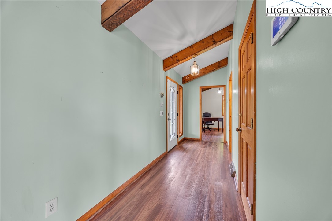 255 Clear View Ridge Crumpler, NC 28617 - Photo 5 of 42 a view of a hallway with wooden floor