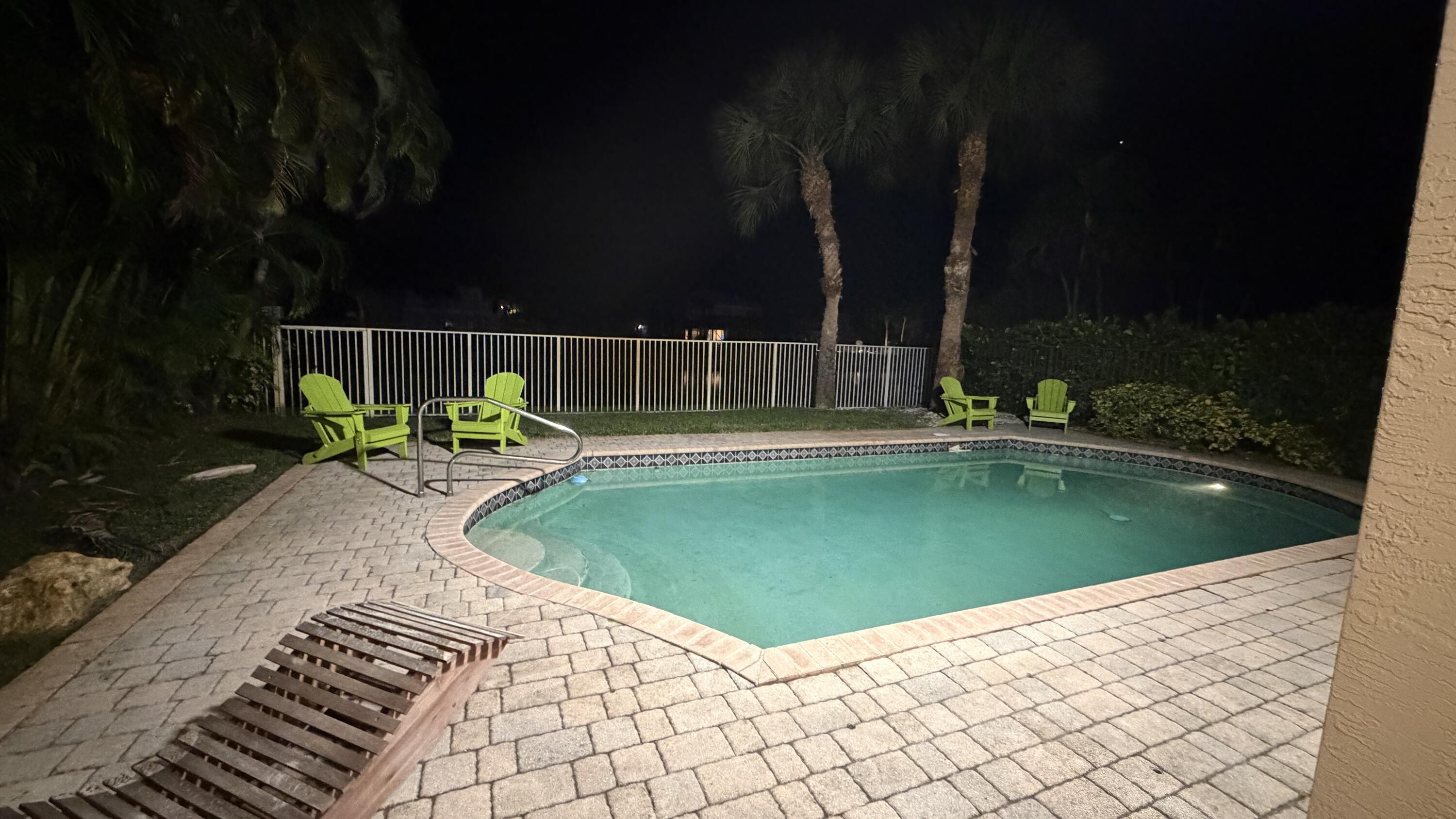 19125 Skyridge Circle Boca Raton, FL 33498 - Photo 25 of 28 a view of a swimming pool with a backyard