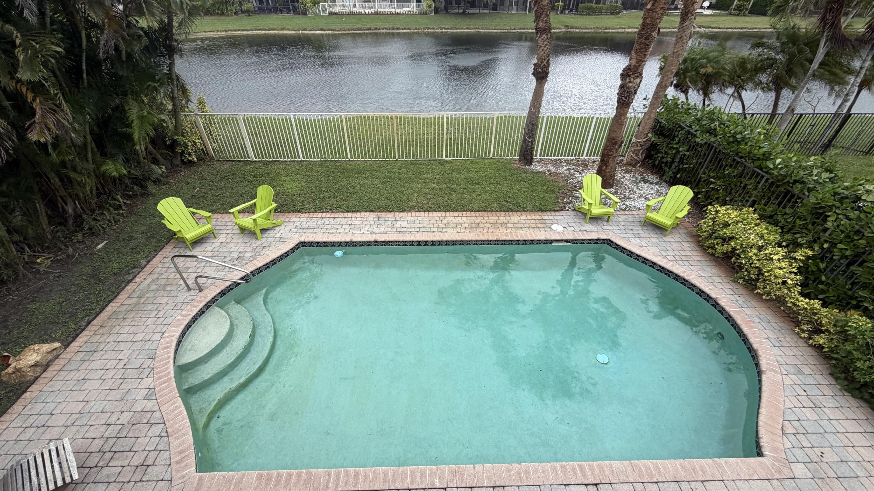 19125 Skyridge Circle Boca Raton, FL 33498 - Photo 26 of 28 a view of a swimming pool with a outdoor seating