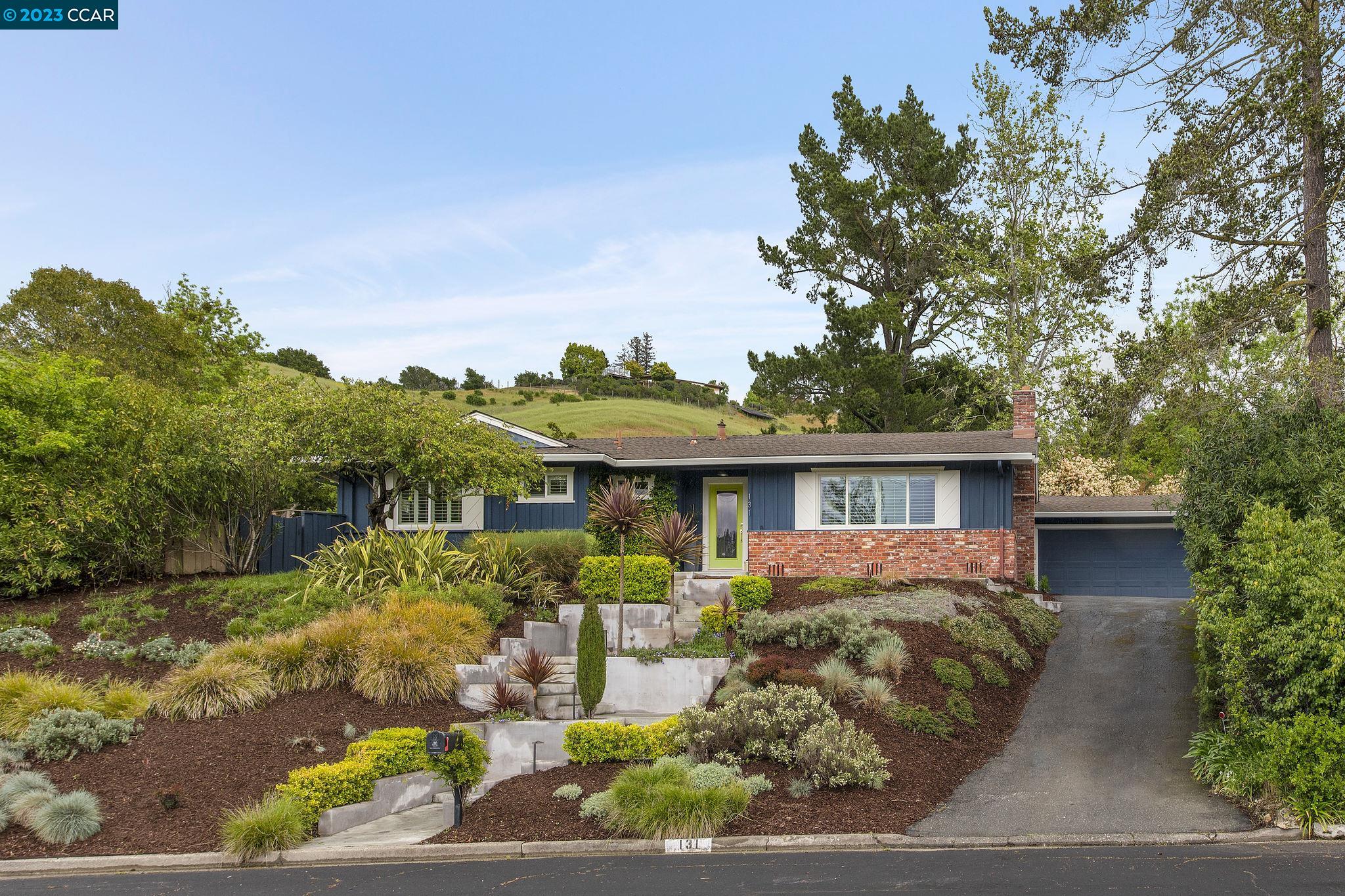 131 Devin Drive Moraga, CA 94556 - Photo 1 of 1 a front view of house with yard and green space
